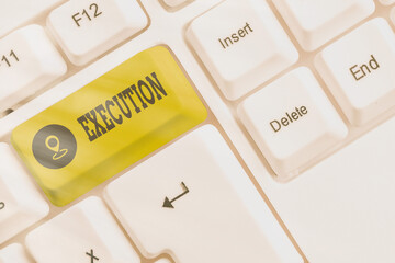 Writing note showing Execution. Business concept for it executes or imposes a program order or...