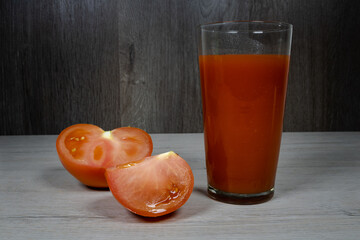 Freshly made tomato juice in a tall glass.