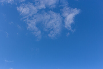 Fototapeta na wymiar White clouds on a blue blue sky.
