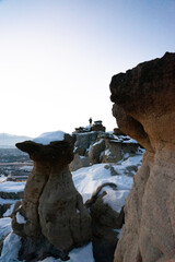 man on distant rocks