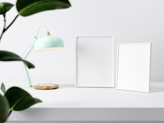 Empty white mock-up picture frames next to light green lamp on white background wall, blurry plant in front, 3D Illustration