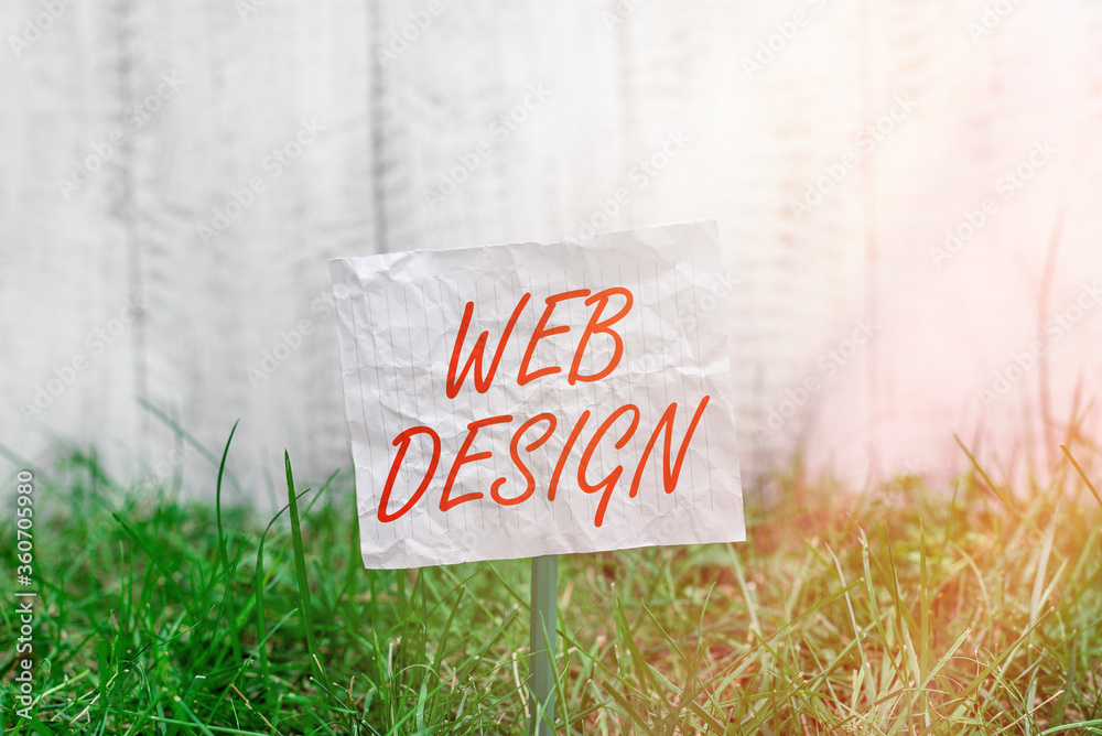 Fototapete Conceptual hand writing showing Web Design. Concept meaning website creation which includes layout, content, and graphics Plain paper attached to stick and placed in the grassy land