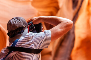 young man in sunglasses and shirt taking a picture