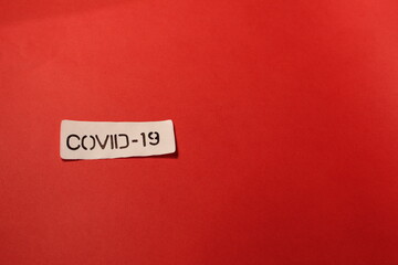 COVID-19 label on a red background