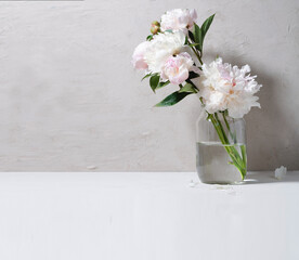 Bouquet of peonies in a glass jar