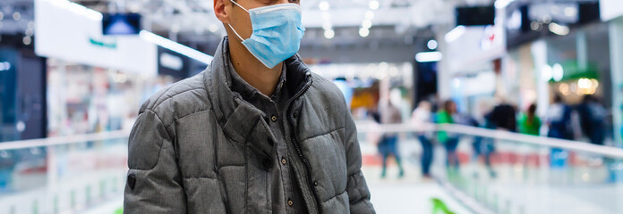 Man wearing mask for protect Novel Coronavirus:2019 or PM 2.5 dust and serious of the air pollution in department store.
