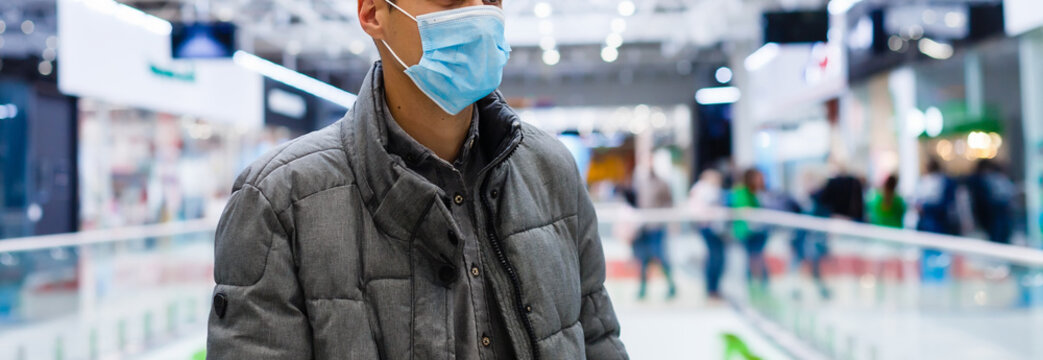 Man wearing mask for protect Novel Coronavirus:2019 or PM 2.5 dust and serious of the air pollution in department store. - Powered by Adobe