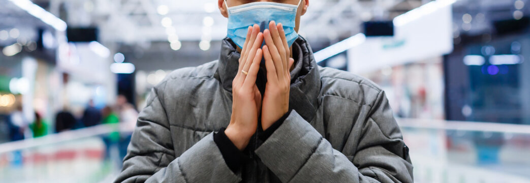 Man wearing mask for protect Novel Coronavirus:2019 or PM 2.5 dust and serious of the air pollution in department store. - Powered by Adobe