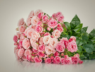 Beautiful Roses Bouquet Flowers Background. Copy spase, flat lay, top view, Holiday symbol. Greeting card