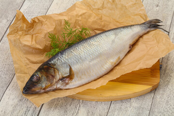 Salted herring over the wooden board