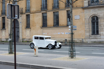 Fototapeta na wymiar Paris, France; January 10, 2020: White ford Model A converted to hot rod, looks like in the street