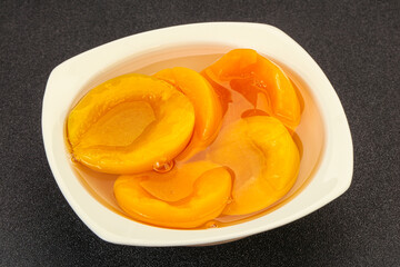 Marinated peaches fruit in the bowl