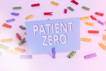 Text sign showing Patient Zero. Business photo text primary disease carrier of the highlycontagious disease Colored clothespin papers empty reminder white floor background office