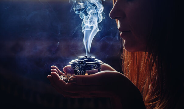 Gently wave fabrics through bakhour smoke to perfume them