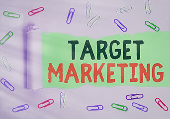 Text sign showing Target Marketing. Business photo showcasing marketer s is most important task also used in buying strategy Rolled ripped torn cardboard placed above a wooden classic table backdrop © Zofia