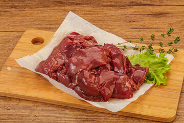 Raw chicken liver over board