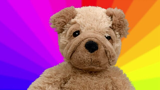 Teddy bear dancing with rainbow background