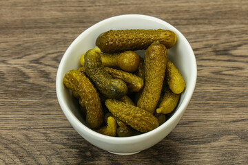 Pickled gherkin in the bowl