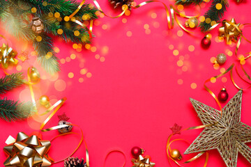 Christmas new year red background with bokeh. festive decorations, fir tree branches on red background. Flat lay, top view, copy space. Winter holiday theme. Happy New Year. Space for text