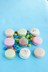 pasta cookies on a blue background  and colored pills