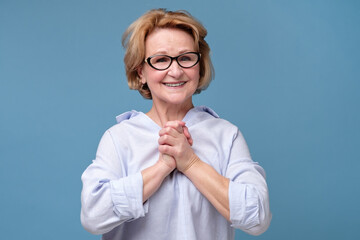 Surprised mature woman being excited surprised with compliment. Looking at camera at studio....