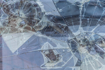 Broken glass, traces of shots in bulletproof glass. Background texture