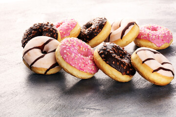 donuts in different glazes frosted with sprinkles