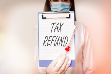 Handwriting text Tax Refund. Conceptual photo excess payment of paid taxes returned to business owners Laboratory blood test sample shown for medical diagnostic analysis result