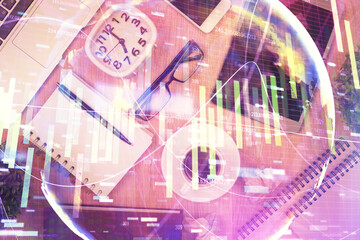 Double exposure of business theme hologram over desktop with phone. Top view. Mobile international...