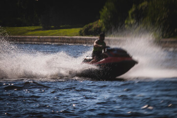 Obraz premium View of jet ski in motion, group of jet skiers with a big water splash