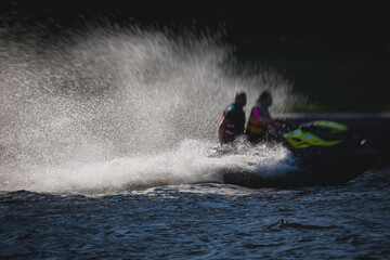 View of jet ski in motion, group of jet skiers with a big water splash