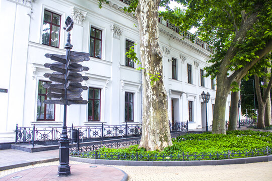 metal street signpost, sign pointing everywhere at the big cities around the world - Powered by Adobe