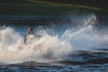 View of jet ski in motion, group of jet skiers with a big water splash