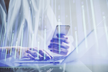 Double exposure of financial graph sketch hologram and woman holding and using a mobile device. Stock exchange concept.