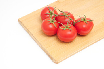 Red tomatoes on white background