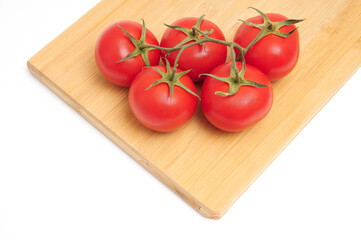 Red tomatoes on white background