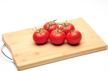 Red tomatoes on white background