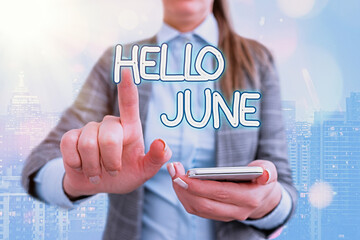Handwriting text writing Hello June. Conceptual photo a new month to plan your activities for fun and adventures Touching screen digital application marking important details in business