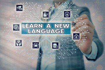 Word writing text Learn A New Language. Business photo showcasing ability to communicate in the...