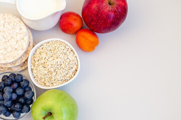 wholesome breakfast with fresh fruit, blueberries, crispbreads and milk.