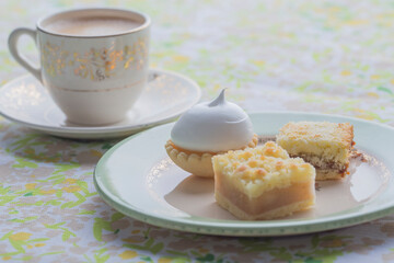 Breakfast with coffe and delicious petit cakes