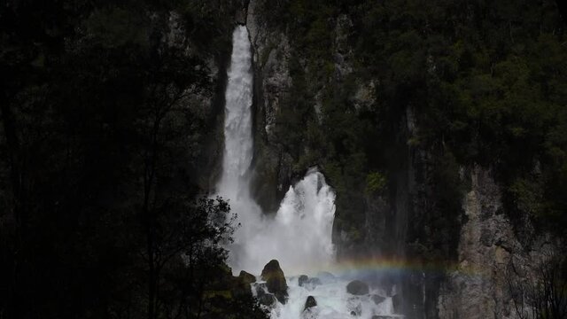 The Tarawera waterfall as it exits the holes in the cliff face after flowing underground for several kilometres