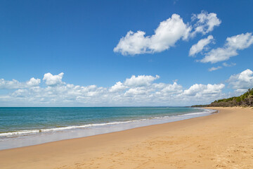 A beautiful calm day at the beach with blue skies