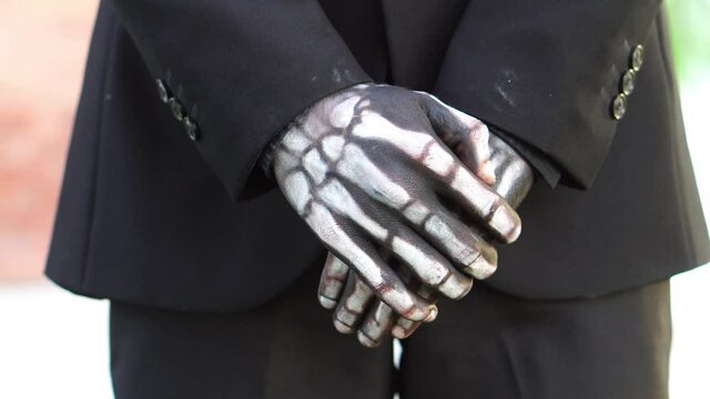 hands of elegant man of death the day of the dead