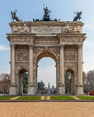 Fototapeta na wymiar Arco della Pace (Porta Sempione - Arch of Peace). This is a major landmark of Milan in front of Park Sempione Castello Sforzesco.