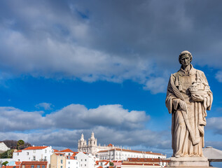 Fototapeta na wymiar Statue of St Vincent in Alfama, located at one of Lisbon's best viewpoints is Miradouro das Portas do Sol (Viewpoint of the Sungates)