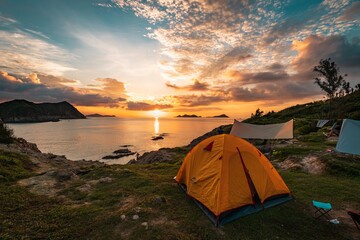 Beautiful mesmerizing seascape at sunset with an orange tent on a foreground
