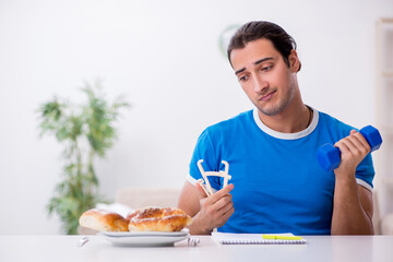 Young hungry man in dieting concept