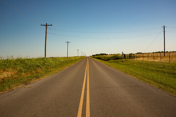 Long Rural Road Through Farmland in Oklahoma