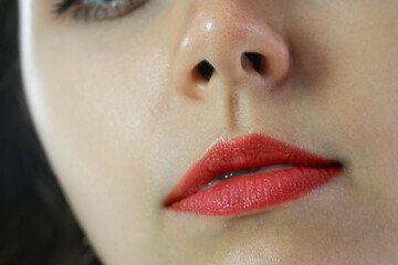 Naklejka premium The picture of a beautiful woman, she has red lips, makeup and eyes. Modern woman style
